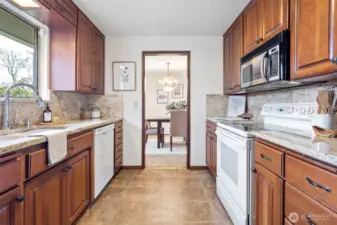 Happy kitchen is well lit and overlooks the beautiful back yard.