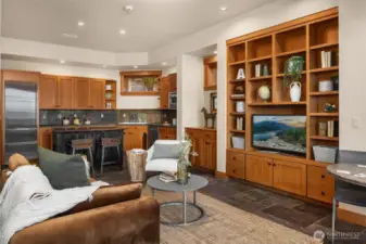 Lower level second kitchen perfect for entertaining poolside. The slate flooring is ideal for  coming in from the lake or pool. Plus 2 beach bathrooms just down the hall.