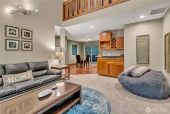 The living room has soring ceilings which gives much light to the area. The custom 'sky-bridge' at the top connects the access to the bedrooms.