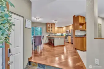 You are greeted by beautiful slate entry and the cherry wood flooring flows through the dining room and fully equipped kitchen. Notice the 'bar area' just to the right inside the living room.