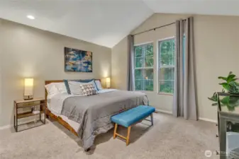 The large primary suite has vaulted ceilings and is located on the opposite side of the two secondary bedrooms---nice privacy!