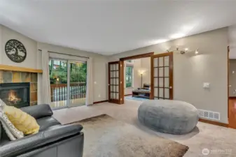 From the family room you can see into the living room. Beautiful French doors offer the option to separate both living areas if you choose.