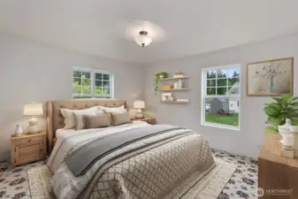 Virtually staged primary bedroom on main floor.  Primary bath is to the left.