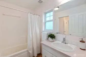Primary bath with a  tub/shower and a separate sink really make this a functional layout.