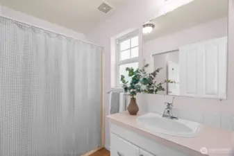 The primary bath is on the main level & has two sinks.  One area has a sink and the tub/shower.  A pocket door can be closed to isiolate the second sink and water closet that guests can access from the living area.