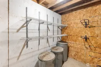 Tack room with saddle racks, shelving and plenty of space for feed storage.