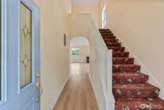 Welcoming 2-story foyer subtly invites you into the rest of the home.  An arched entrance provides a glimpse into the living room with a cozy gas fireplace. It’s a space that says, “Come in, take off your coat, and stay awhile.”  The stairwell leads to 2 additional bedrooms and a full bath on the second floor.
