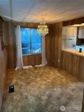 Dining room off kitchen and on the other side of the family room with pellet stove.