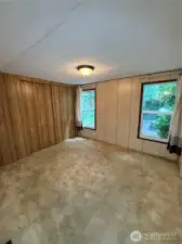 This is the largest bedroom and at the back of the house. Windows overlook the backyard.