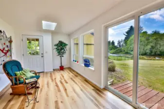 Sun Room has access to detached Garage and Back Yard.