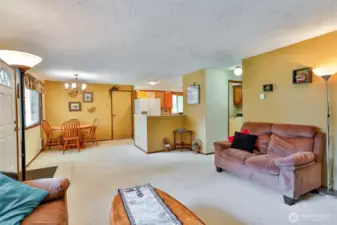 Living Room opens to the Dining and Kitchen.