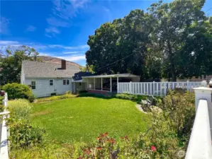 Vinyl fencing encloses backyard.