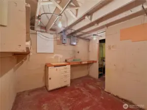 Enclosed storage room in basement.