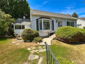 Walk up to home is elevated from street level with mature plantings offering privacy.