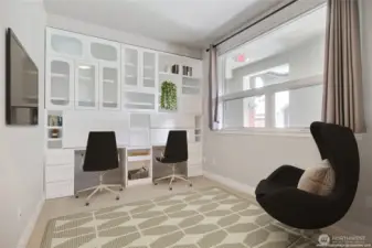 2nd/Guest Bedroom is equipped with a built-in desk and plenty of storage space for a home office.