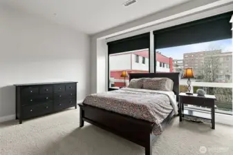 The expansive windows provide an ever-changing panorama that perfectly captures the essence of city living.