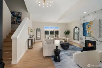 Well lit living room high ceilings.