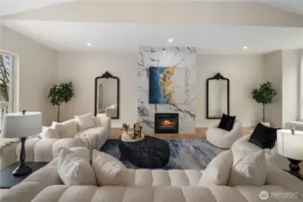Spacious living room with fireplace, perfect for gatherings.