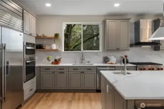 New kitchen with sub zero refrigerator and quartz countertops.