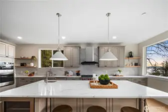 Spacious kitchen island with prep sink. View of Lake Washington from the window.