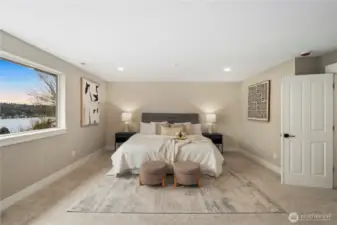 Spacious primary bedroom upstairs with views of Lake Washington.