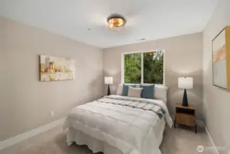 Spacious primary bedroom upstairs.