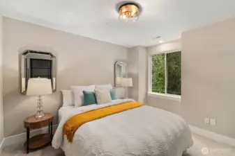 Spacious primary bedroom upstairs.