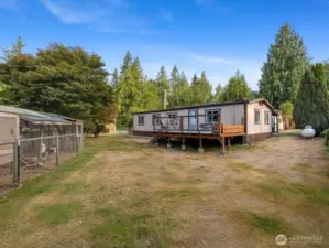 Fully fenced yard with mature landscaping.