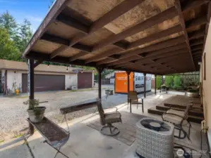 Covered front patio offers outdoor living year round.