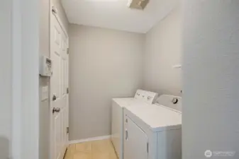 Utility Room - door leads to garage and loft storage.