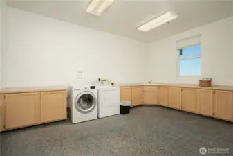 Common area shared laundry on garage floor