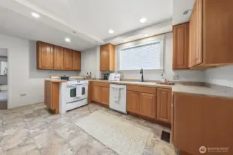 This wall between the kitchen and family room is not load bearing and can be removed.