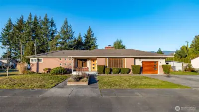 This hard to find Mid Century Modern has lots of Curb appeal on this large corner lot!  There is lots of parking here too!