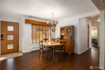 The formal dining room has newer LVP flooring  & a wood valance.