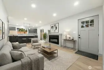 Light filled open living space with cozy fireplace.