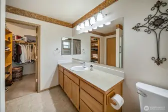 Views into the second, walk in closet for the primary