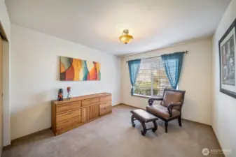 Bedroom #2 at the front of the house with views to the sidewalk and street. It would also make a great office