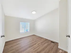 Flexible den space that works well as a home office, hobby room, media space, or optional fourth bedroom.