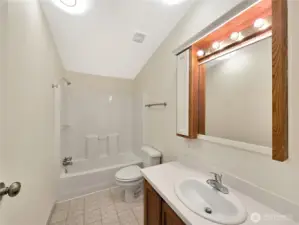 Full hall bath conveniently located to serve the secondary bedrooms and guests.