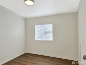 Second bedroom offering a functional layout and convenient access to the hall bath.