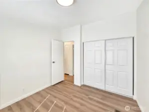 Third bedroom offering a functional layout and convenient access to the hall bath.