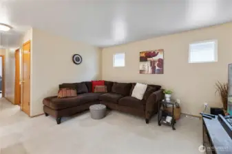 Privately situated picture windows & neutral paint create a warm & inviting space