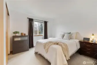 The primary suite is spacious and offers an ensuite full bath.