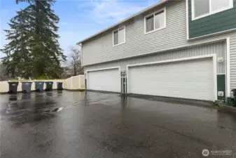The spacious 2 car garage is finished and offers storage shelves.