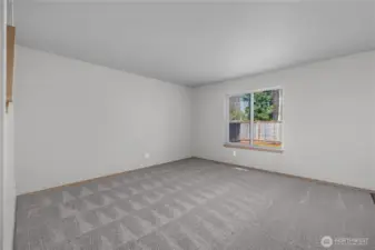 Spacious living room on main floor. New carpet throughout unit (7017).