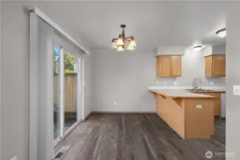 Dining room features sliding door to backyard