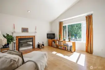 Cozy up to the wood-burning fireplace during the cooler months, with gas plumbing already in place should you wish to convert.