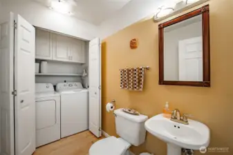 Main floor powder room with laundry area.