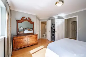 Another view from the primary bedroom looking towards the bathroom and walk-in closet behind the closed door.
