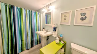 A stylish first-floor bathroom featuring carefully selected designer colors that enhance the space with warmth and sophistication.